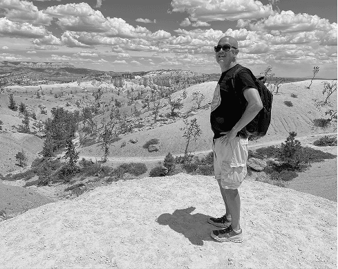 Ernest standing on a rocky overlook